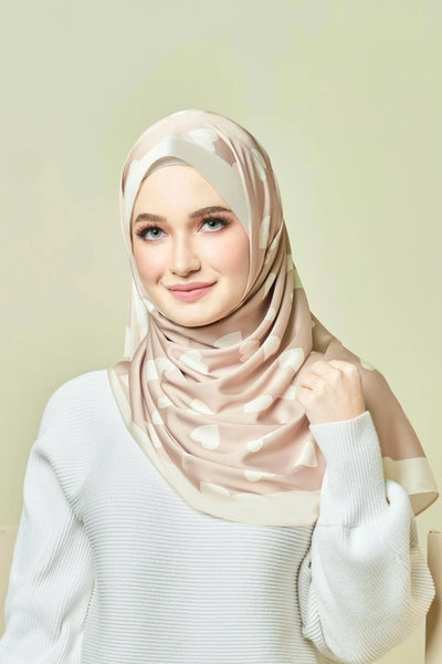 Beige heart patterned hijab on a model  top rated for modest fashion and stylish headscarves