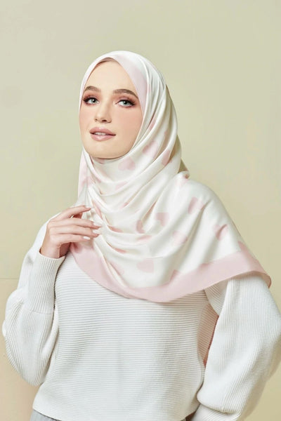 Soft pink hijab featuring a heart design, blending comfort with contemporary modest style ideal for everyday elegance