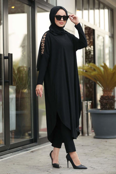 A chic black tunic with a relaxed fit, featuring subtle leopard print embellishments on the arms
