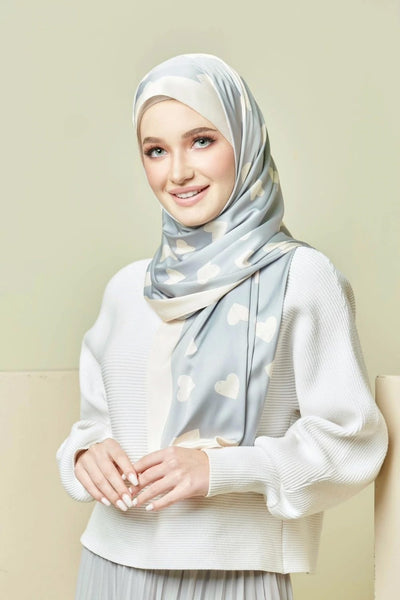 Light Blue Silk hijab with white heart patterns and elegant draping, perfect for fashionable modest wear