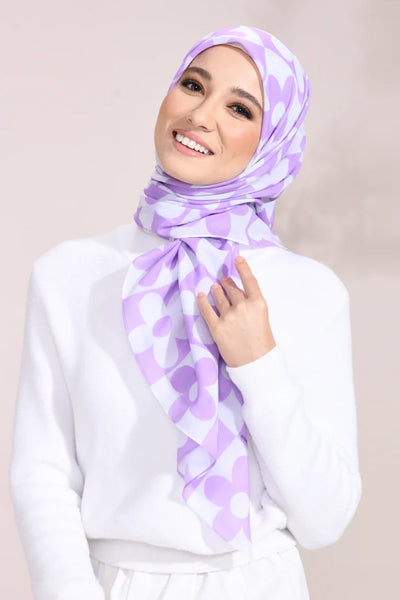 Lilac Blossom Hijab with white floral pattern on a light fabric, perfect for stylish modest fashion enthusiasts