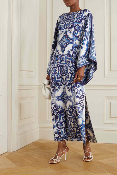 Blue and white porcelain patterned kaftan on a model against a neutral backdrop, ideal for elegant wear