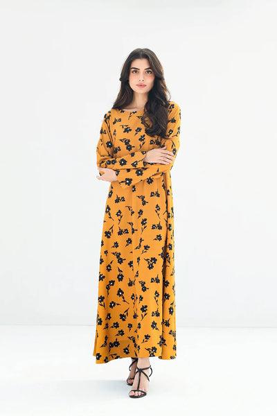 Mustard yellow longline kurti with black floral print, full sleeves, and black strappy sandals for a fashionable traditional outfit