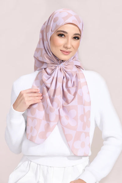 Light pink floral hijab with soft pastel flower patterns for a sophisticated, modest look