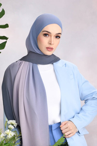 Woman wearing a Luxe Dove Grey Hijab Scarf, ideal for fashion forward modest apparel.