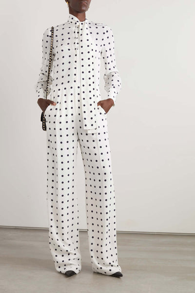 Elegant white high-collar polka dot jumpsuit on model