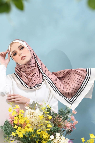Stylish pink polka dot hijab with black and white striped accent, perfect for contemporary modest fashion enthusiasts