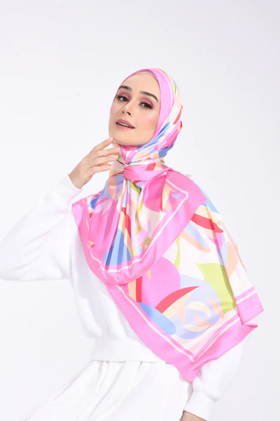 Colorful Spectrum Elegance Scarf in silk fabric with pink, blue, orange, and yellow patterns