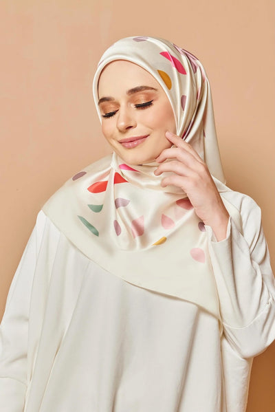  Womens Scarf on a model, featuring trendy leaf patterns on ivory fabric, ideal for a stylish modest look.