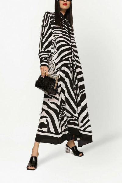 Black and white zebra stripe longline shirt with a classic collar and button-up front, showcasing a bold animal print for a statement outfit piece.